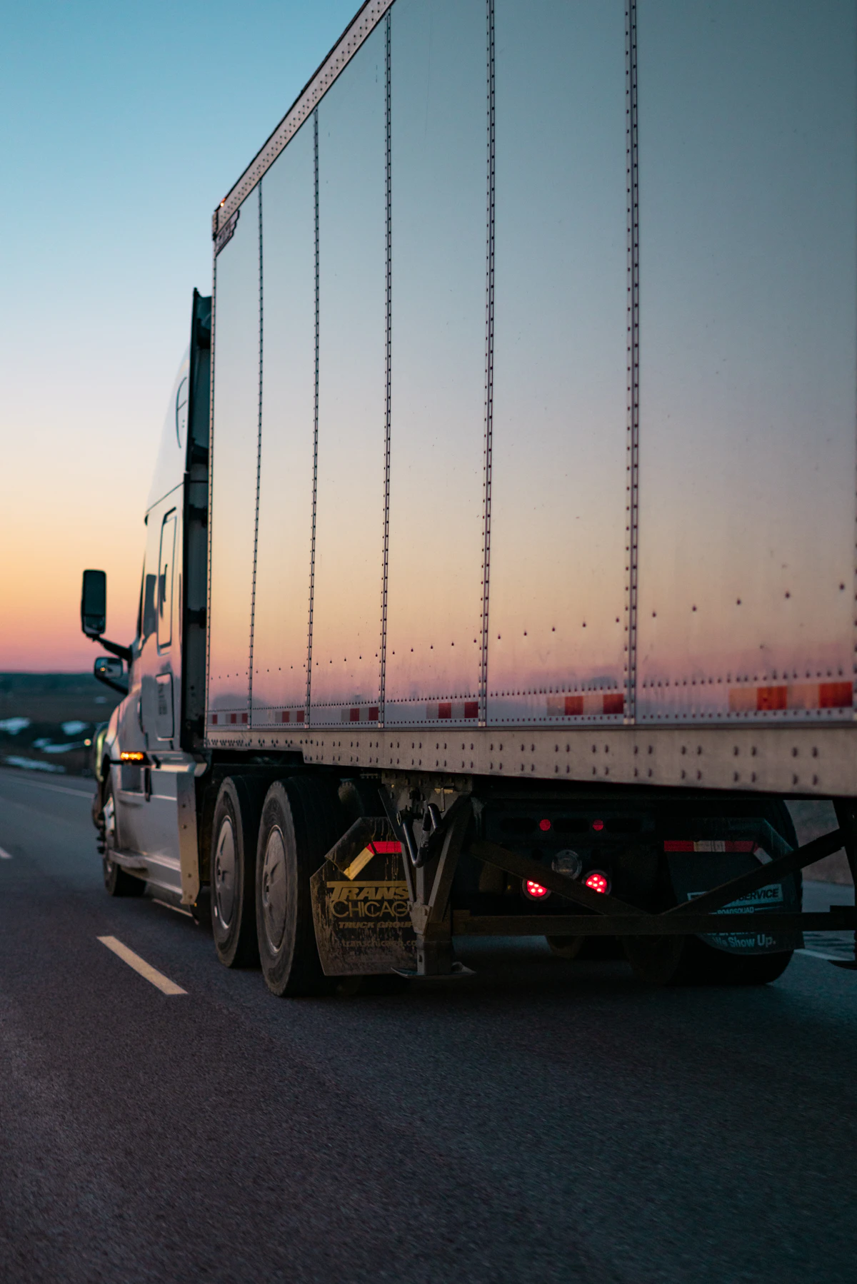 Freight truck on the road at sunset